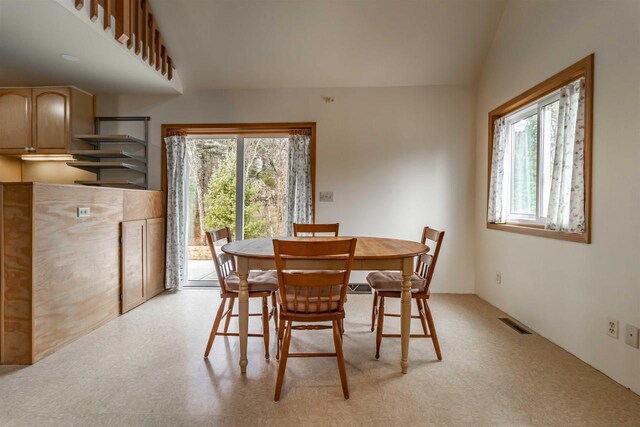 1735 W 19th Ave, Arkdale, WI 54613 - dining area featuring visible vents, plenty of natural light, and lofted ceiling