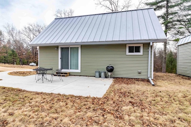 1735 W 19th Ave, Arkdale, WI 54613 - rear view of property with a patio area, metal roof, and a standing seam roof