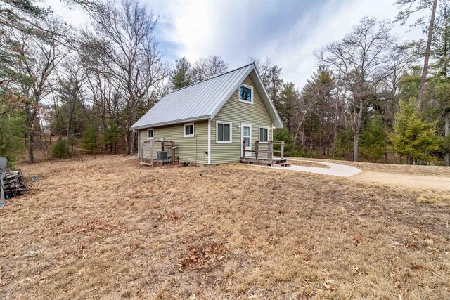 1735 W 19th Ave, Arkdale, WI 54613 - view of home's exterior featuring metal roof