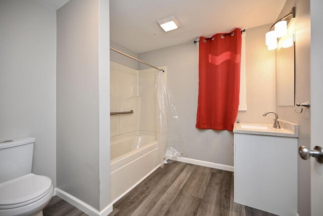 458 High Forest St, Winona, MN 55987 - full bathroom featuring baseboards, toilet, wood finished floors, vanity, and shower / bathtub combination with curtain