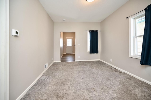 458 High Forest St, Winona, MN 55987 - spare room featuring carpet flooring, baseboards, and visible vents
