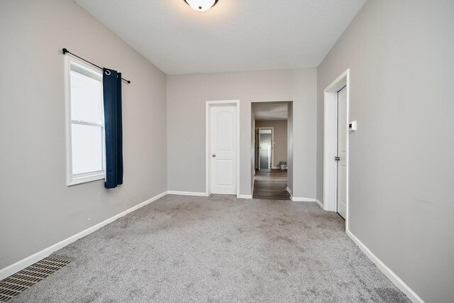 458 High Forest St, Winona, MN 55987 - interior space with visible vents, carpet floors, a textured ceiling, and baseboards