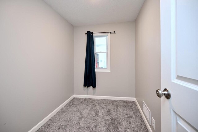 458 High Forest St, Winona, MN 55987 - empty room featuring carpet flooring, a textured ceiling, baseboards, and visible vents