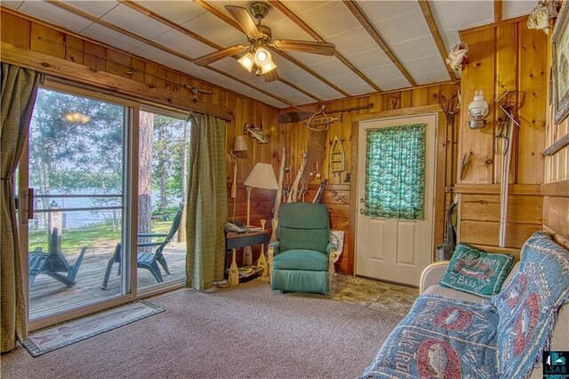 9293 N County Hwy E, Hayward, WI 54843 - unfurnished room with carpet flooring, wood walls, and a ceiling fan
