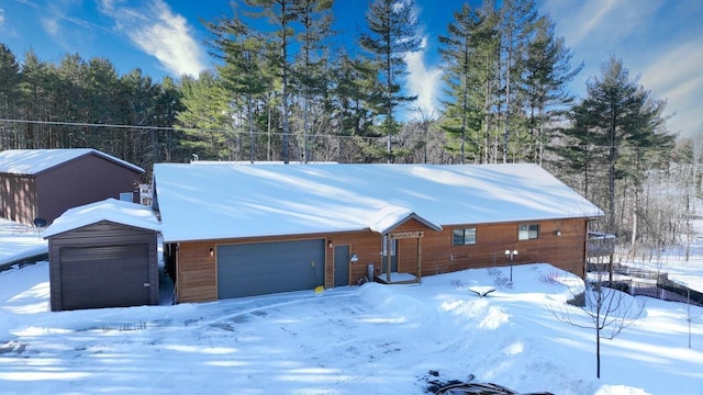 1055 Shishebogama Dr, Minocqua, WI 54548 - view of front facade featuring a garage