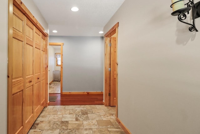 1055 Shishebogama Dr, Minocqua, WI 54548 - hall with recessed lighting, baseboards, and light stone finish flooring