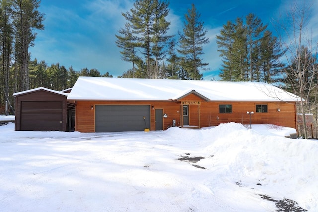 1055 Shishebogama Dr, Minocqua, WI 54548 - view of front of house with an attached garage