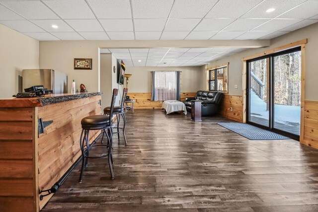1055 Shishebogama Dr, Minocqua, WI 54548 - indoor dry bar featuring wood finished floors, recessed lighting, a wainscoted wall, wood walls, and a drop ceiling