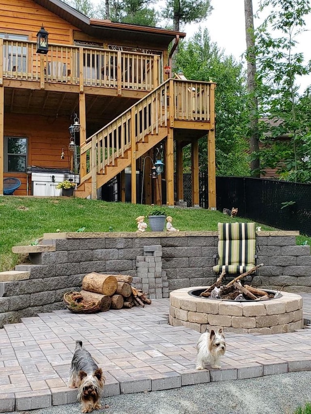 1055 Shishebogama Dr, Minocqua, WI 54548 - view of patio with a fire pit, a deck, and stairway