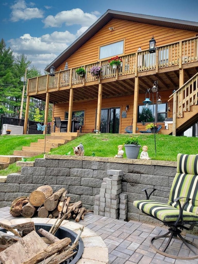 1055 Shishebogama Dr, Minocqua, WI 54548 - back of property with a wooden deck and stairs