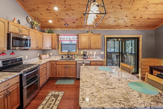 1055 Shishebogama Dr, Minocqua, WI 54548 - kitchen with appliances with stainless steel finishes, a sink, lofted ceiling, wooden ceiling, and healthy amount of natural light