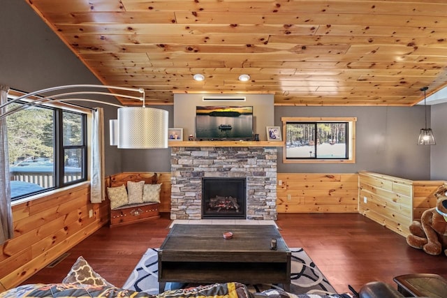 1055 Shishebogama Dr, Minocqua, WI 54548 - living area featuring wood ceiling, wood finished floors, plenty of natural light, and a fireplace