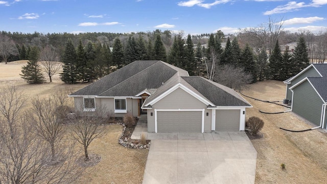 birds eye view of property with a forest view