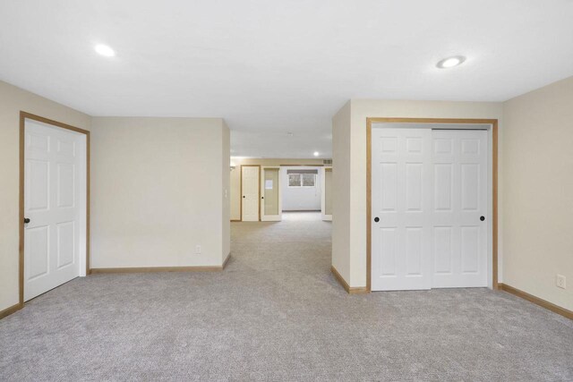 unfurnished room with recessed lighting, baseboards, and carpet floors