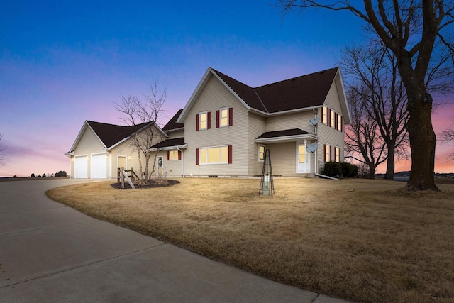 2721 Powder Hill Rd, Slinger, WI 53086 - view of front facade featuring driveway, an attached garage, and a front yard