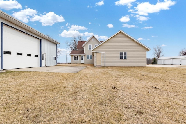 2721 Powder Hill Rd, Slinger, WI 53086 - rear view of property with a lawn and a garage