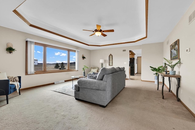 2721 Powder Hill Rd, Slinger, WI 53086 - living room with ceiling fan, a raised ceiling, visible vents, and light carpet