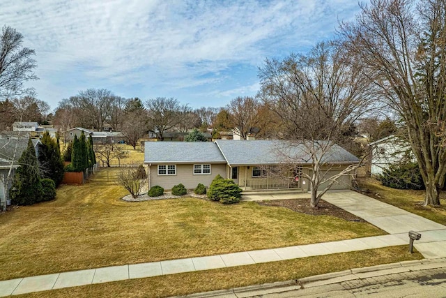 single story home featuring driveway and a front lawn