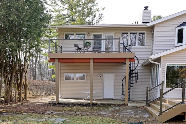 3125 Dans Dr, Stevens Point, WI 54481 - back of property featuring stairs, a patio area, fence, and a chimney