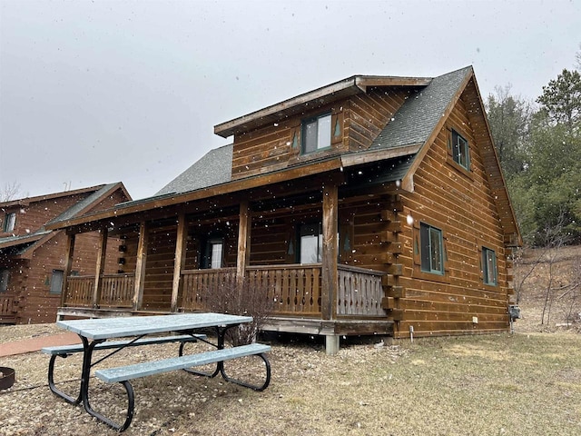 615 Sandy Beach Ct, Warrens, Warrens, WI 54666 - rear view of property featuring a porch and roof with shingles