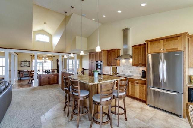 N4795 County Road V, Poynette, WI 53955 - kitchen with high vaulted ceiling, a kitchen breakfast bar, wall chimney range hood, black appliances, and brown cabinets