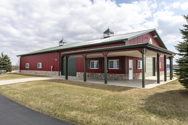 N4795 County Road V, Poynette, WI 53955 - exterior space with a garage and a lawn