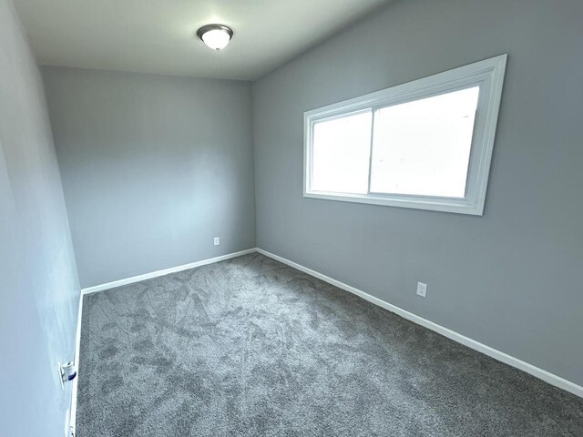 6082 N 36th St, Milwaukee, WI 53209 - spare room featuring carpet flooring and baseboards