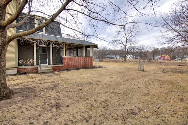 435 Jefferson St, Eau Claire, WI 54701 - view of yard with a sunroom