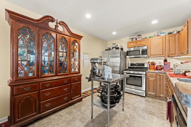 4229 W Howard Ave, Milwaukee, WI 53221 - kitchen with recessed lighting, baseboards, and appliances with stainless steel finishes