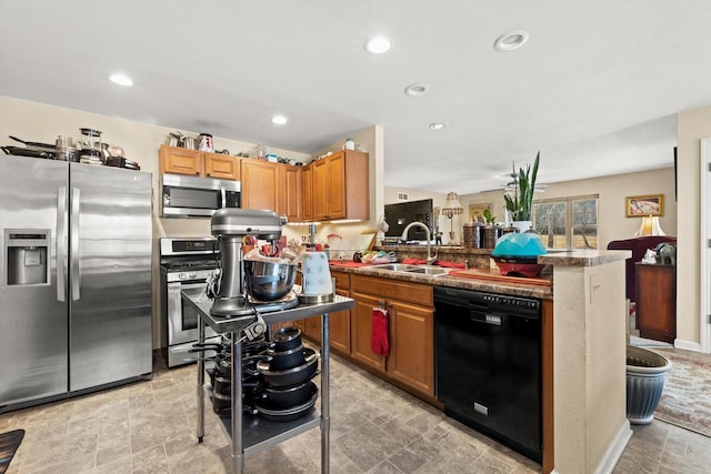 4229 W Howard Ave, Milwaukee, WI 53221 - kitchen with a sink, stainless steel appliances, a peninsula, and recessed lighting