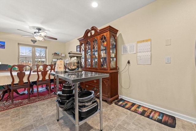 4229 W Howard Ave, Milwaukee, WI 53221 - dining space with baseboards, a ceiling fan, and stone finish floor