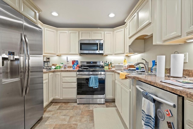 4229 W Howard Ave, Milwaukee, WI 53221 - kitchen with cream cabinetry, a sink, recessed lighting, stainless steel appliances, and light countertops
