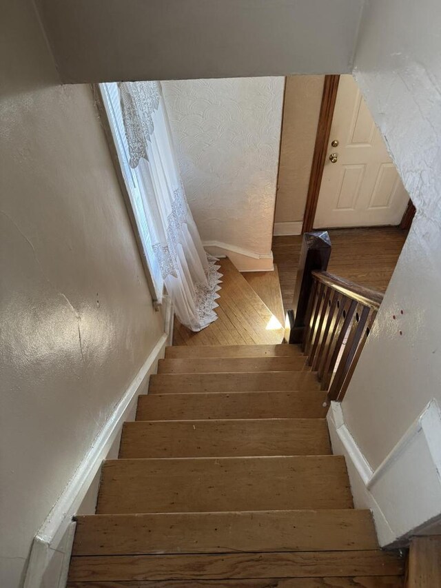 7126 W Congress St, Milwaukee, WI 53218 - stairs featuring wood finished floors and baseboards