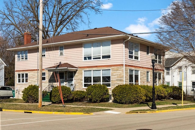 1-3 Mechanic St, Edgerton, WI 53534 - view of front facade featuring stone siding and a chimney