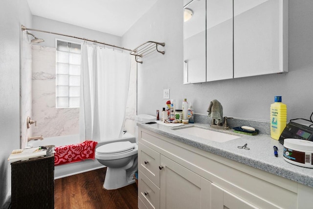 1-3 Mechanic St, Edgerton, WI 53534 - full bathroom featuring toilet, wood finished floors, vanity, and shower / bath combo