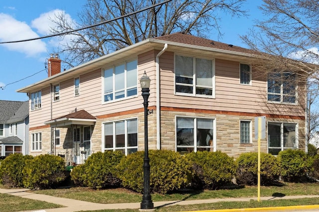1-3 Mechanic St, Edgerton, WI 53534 - view of front of home featuring a chimney and stone siding