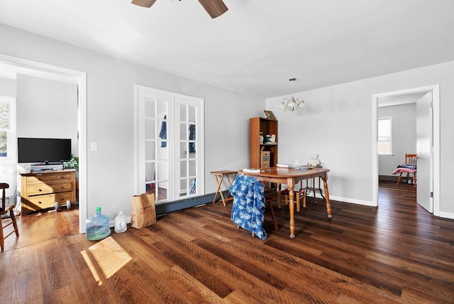 1-3 Mechanic St, Edgerton, WI 53534 - dining room with baseboards, wood finished floors, baseboard heating, and ceiling fan with notable chandelier