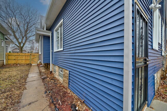 view of side of property with fence
