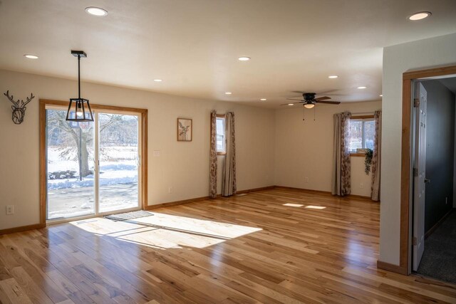N2547 County Road G, Mauston, WI 53948 - unfurnished dining area featuring ceiling fan, light wood finished floors, plenty of natural light, and baseboards