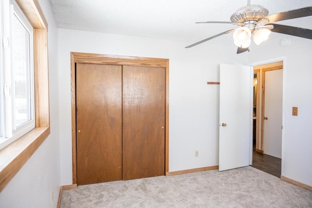 N2547 County Road G, Mauston, WI 53948 - unfurnished bedroom with a closet, baseboards, ceiling fan, and carpet