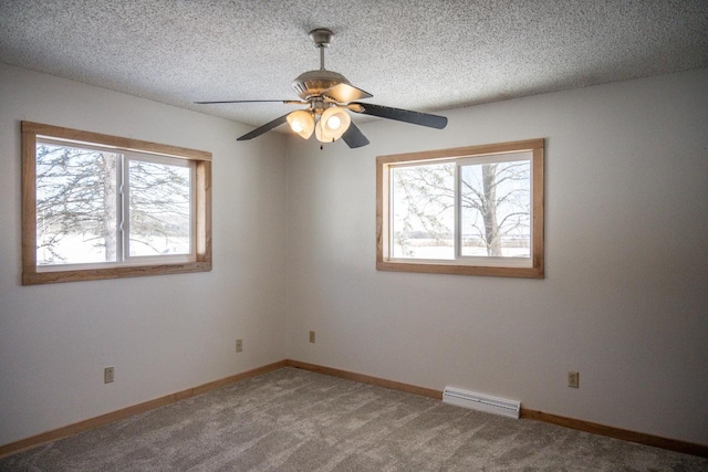 N2547 County Road G, Mauston, WI 53948 - carpeted spare room with visible vents, ceiling fan, baseboards, and a textured ceiling