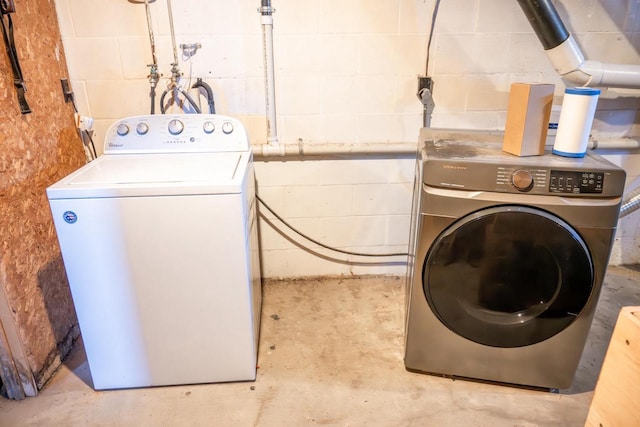 N2547 County Road G, Mauston, WI 53948 - clothes washing area featuring laundry area, concrete block wall, and washer / dryer