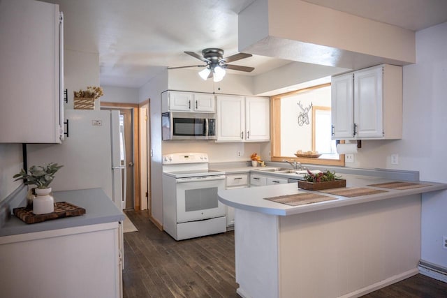 N2547 County Road G, Mauston, WI 53948 - kitchen featuring white appliances, dark wood-style floors, a peninsula, white cabinets, and ceiling fan
