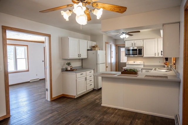 N2547 County Road G, Mauston, WI 53948 - kitchen featuring dark wood-style floors, a ceiling fan, stainless steel microwave, a sink, and electric range oven
