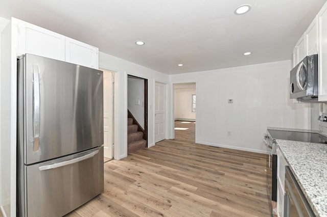 kitchen featuring white cabinetry, light wood-style flooring, recessed lighting, and appliances with stainless steel finishes