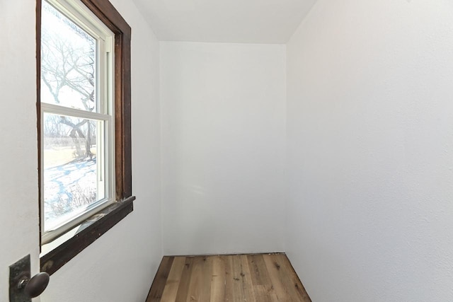 spare room with light wood-style floors and a healthy amount of sunlight