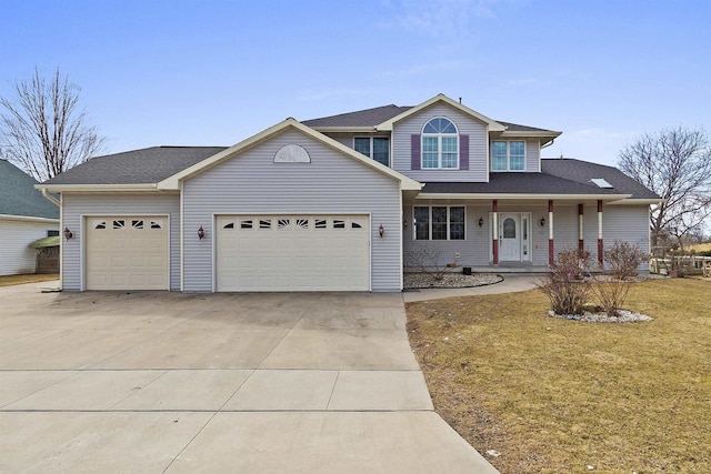 2155 Cottonwood Dr, Menasha, WI 54952 - traditional home featuring a front yard, covered porch, concrete driveway, and an attached garage