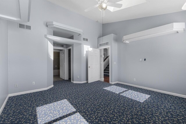 2155 Cottonwood Dr, Menasha, WI 54952 - carpeted spare room with visible vents, lofted ceiling, and ceiling fan