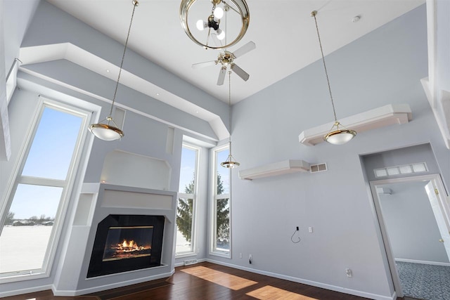 2155 Cottonwood Dr, Menasha, WI 54952 - unfurnished living room with visible vents, plenty of natural light, ceiling fan, and wood finished floors