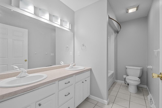 2155 Cottonwood Dr, Menasha, WI 54952 - full bath with tile patterned floors, double vanity, toilet, and a sink